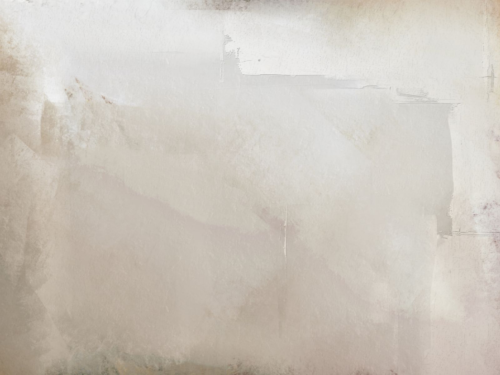 A pale plastered wall with a soft, uneven texture in warm off-white tones